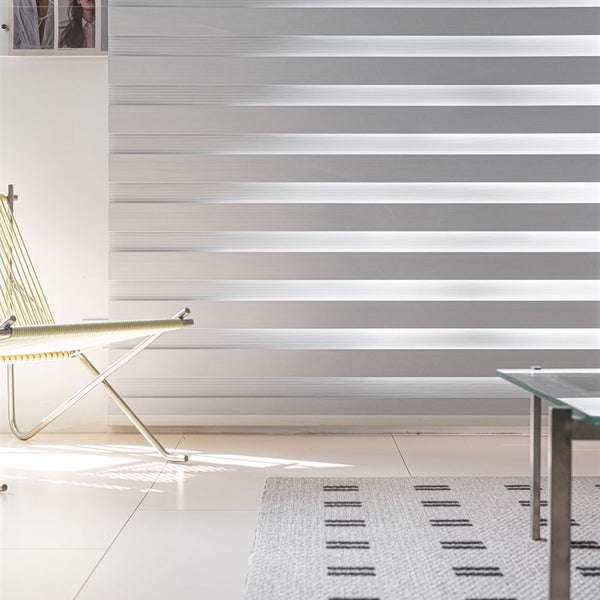 Premium day and night roller blinds with dual layer zebra fabric in a modern interior - image 3
